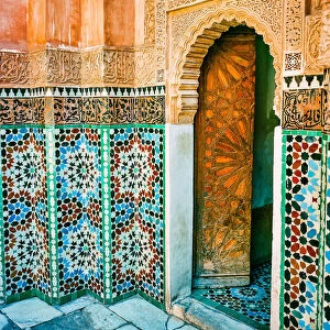 Ornate Tiled Wall and Open Wooden Door in Marrakech Morocco