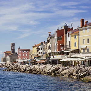 Piran lighthouse and houses at the waterfront
