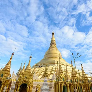 shwedagon pagoda under blue sky, yangon, myanmar