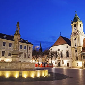 Slovakia, Bratislava, Illuminated town square at dusk