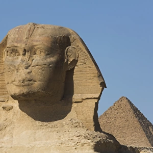 Sphinx (foreground), Pyramid of Mycerinus (background), The Giza Pyramids