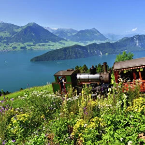 steam railway climbing Mount Rigi, Lake Lucerne, Burgenstock mountain and Pilatus mountain at the back, Vitznau, Canton of Lucerne, Switzerland