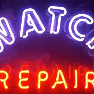 Store sign of watch repair shop in New York City, USA