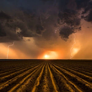 Sunset Thunderstorm over a ploughed field, Nebraska. USA