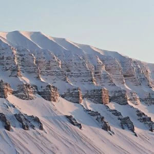 Typically shaped mountain in a wintry Spitsbergen, Svalbard, Norway, Europe