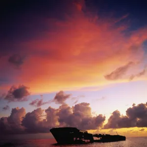 West Indies, Grand Cayman, Seven Mile Beach, ship wreck at sunset