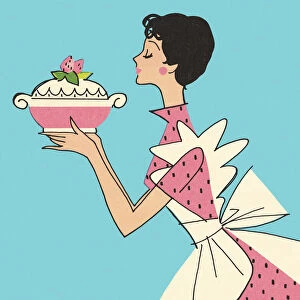 Woman Carrying a Dish with a Strawberry Dessert