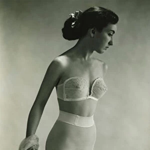 Woman in underwear posing in studio, (B&W), portrait