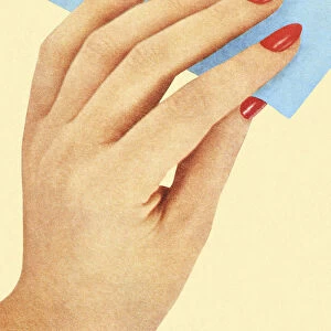 Womans Hand With Red Nail Polish