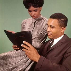 Young couple reading bible