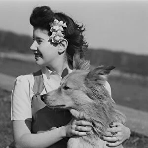 Young woman with dog outdoors