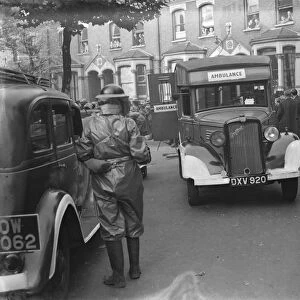 Air Raid Precaution exercise on Old Kent Road in London. A Bedford ambulance taking