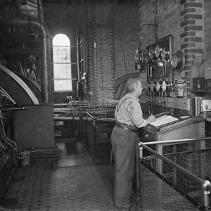 Gravesend Water Works in Kent. A worker in the control room. 1939