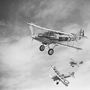 A Hawker Hart of No. 23 Squadron RAF flying in formation over the Medway area in Kent