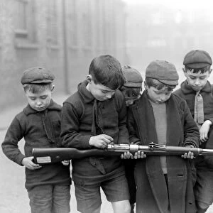 Infants of the Blackhorse Road School, Walthamstow presented with a German rifle