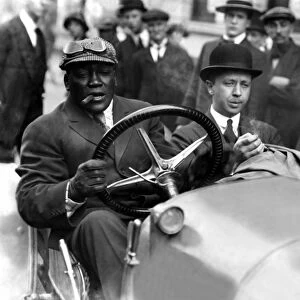 Jack Johnson, the boxer taking a spin in his car