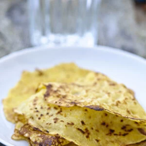 Mexican corn pancakes stacked on white plate credit: Marie-Louise Avery / thePictureKitchen