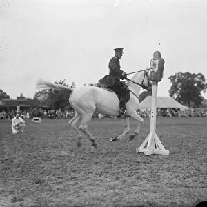 A mounted policeman competing in the truncheon event at the Metropolitan