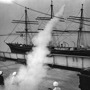 Naval cadets fire a smoke rocket with a lifeline over the rigging of the Cutty Sark