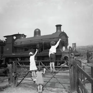 1936 Print: Children Waving to Train Driver 1936 Print: Children Waving to Train Driver
