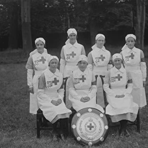 Nurses pose with the Stanley Shield for the British Red Cross Society following the