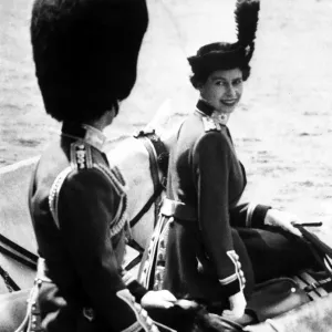 The Queen in Coldstream Guards uniform, riding side-saddle The Queen in Coldstream Guards uniform, riding side-saddle