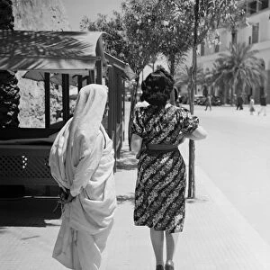 Tripoli. Contrast in fashion, and native Arab and a modern Italian girl