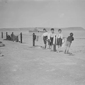 Four boys on the quay, Portreath, Cornwall. Early 1900s