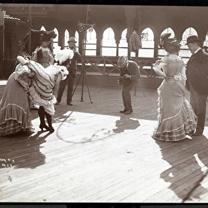 Five actresses in costume rehearsing on the roof of what is probably the New York Theatre