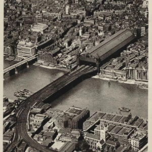 Aerial view of Cannon Street Station, terminus of the Southern Railway in the City of London (b / w photo)