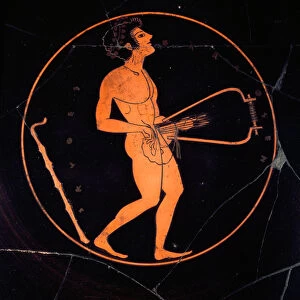 Etruscan art: Kylix black terracotta decorates the representation of a lyre player