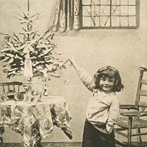 An excited young child on Christmas morning (b / w photo)