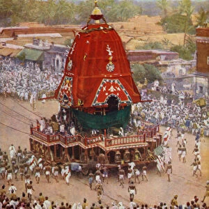 Massive car of the Hindu god Juggernaut, Lord of the World, being dragged by devotees, at Puri in Orissa, India (b / w photo)