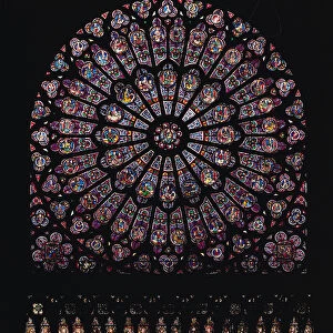 North transept rose window depicting the Virgin and Child in the centre surrounded by Old