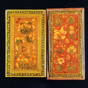 A pair of Safavid dynasty mirror cases, painted with floral designs