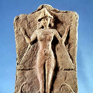 Plaque depicting a winged goddess, possibly Ishtar or Ereshkigal, standing on two ibexes