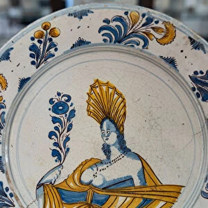 Plate decorated by a womans bust, 18th century (majolica)