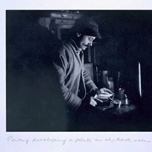Ponting developing a plate in the dark room, from Scotts Last Expedition