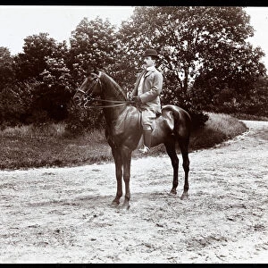 Portrait of Otto Kahn posed on a horse on the bridle path in Central Park, New York