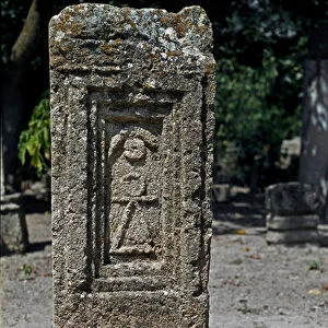 Punic stele in sandstone, with sign of Tanit and astral symbols, 5th-3rd century BC