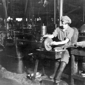 Woman operating a broaching machine in an Eddystone Rifle Plant. Print