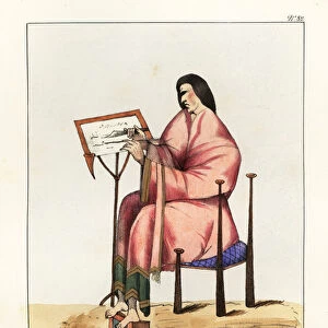 Scribe at work with quill and knife at a writing desk, seated on a chair with footrest, 9th century