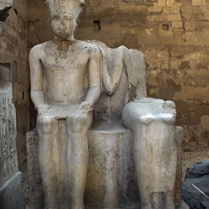 Statue of Pharaoh Ramses II near a deity. (sculpture)