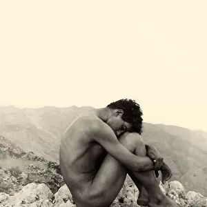 Study of a male nude on a rock, Taormina, Sicily, c. 1900 (sepia photo)