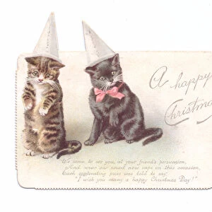 A Victorian Christmas card of two kittens wearing dunce caps, c. 1880 (colour litho)
