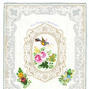 A Victorian paper lace Valentine card of roses and a robin with an envelope in it