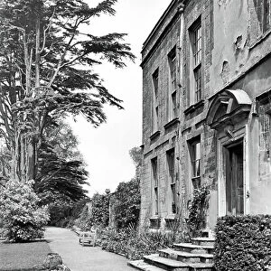 View along the south front, Canons Ashby, from The English Country House (b/w photo)