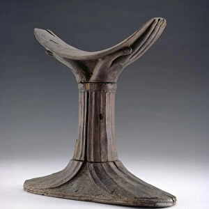 Wooden headrest, the headpiece carved in the shape of a pair of cupped hands (wood)