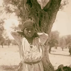 Young girl standing front tree 1898 Middle East
