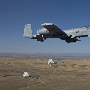 An A-10C Thunderbolt releases two High Drag BDU-50s over Idaho